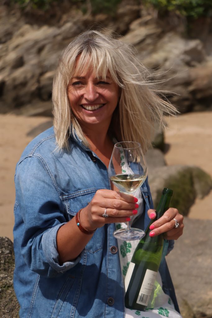 Wine expert Elly Owen on beach