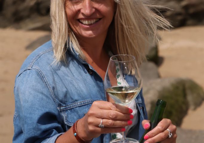 Wine expert Elly Owen on beach